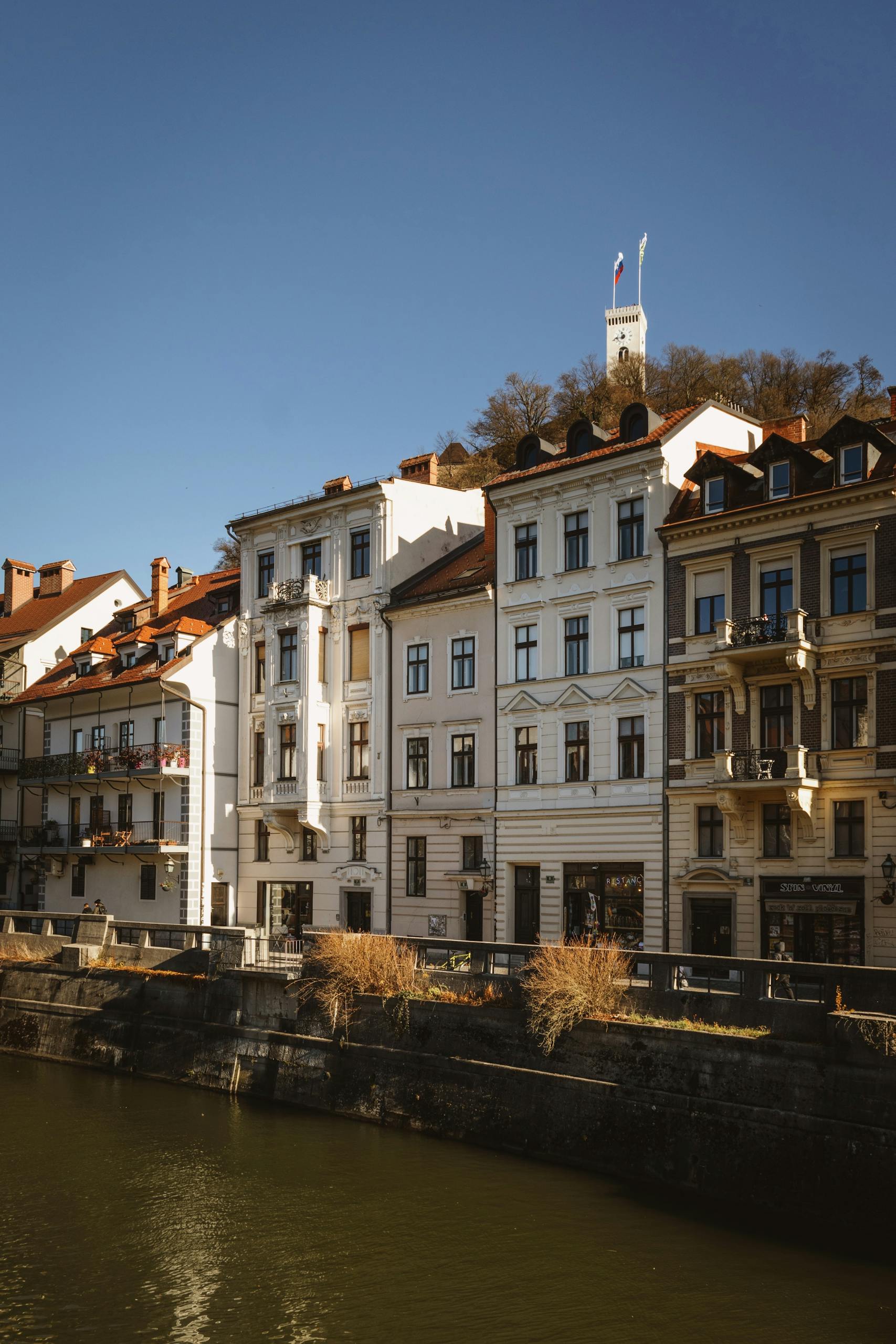 Historic riverside buildings along the Ljubljanica River in Ljubljana, Slovenia.